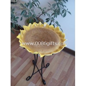 Yellow garden ornamental bird bath
