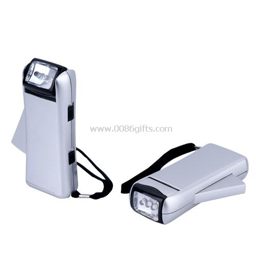 Hand press flashlight