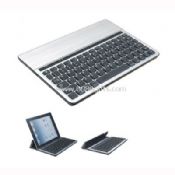 Bluetooth keyboard with flip-up brace to hold iPad in use images
