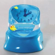 Liquid clock with floater images